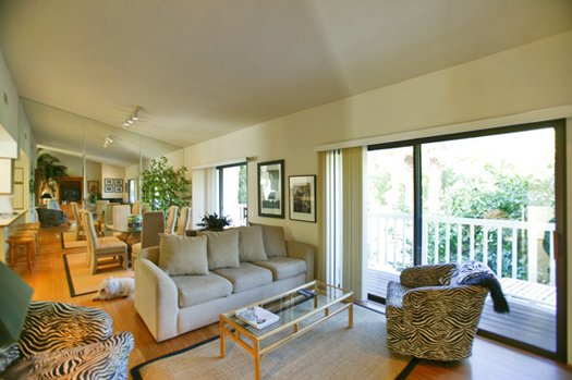 Living room and formal dining area with mountain view balcony