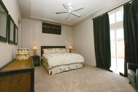 Generously sized master bedroom with slider to the pool area 