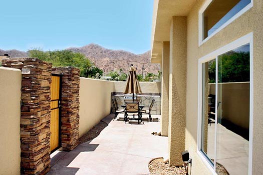 Courtyard surrounded by a perimeter privacy wall high enough to afford a very private setting 